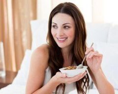 Girl eats buckwheat porridge